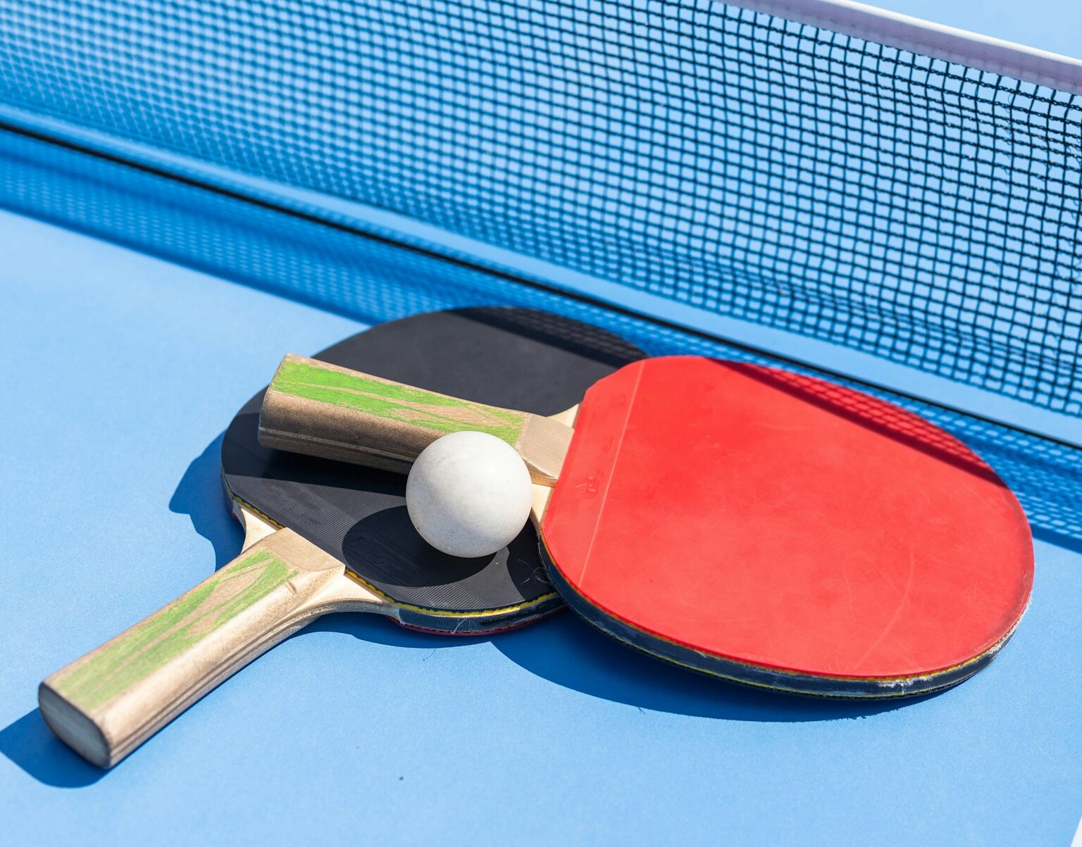 table tennis ball and paddle